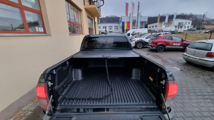 Roll cover, bed liner, bullbar, window visors, hood guard, spot lights installed on Hilux