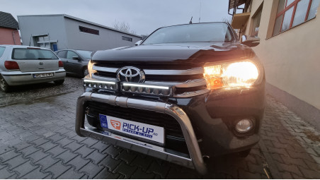 Roll cover, bed liner, bullbar, window visors, hood guard, spot lights installed on Hilux