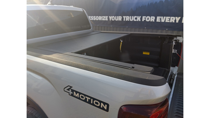 Roll Cover, bed liner, side steps installed on Volkswagen Amarok 2024